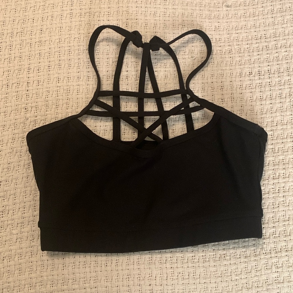 Black strappy sports bra. Lightly worn no damage no tags.